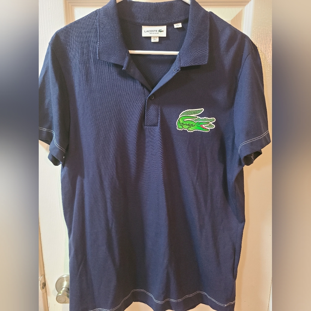 Lacoste Dark Blue Polo with Vibrant Green Emblem